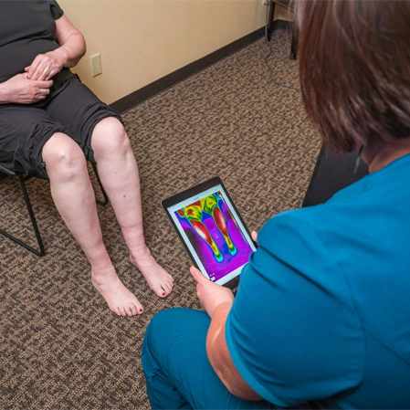 Chiropractor Windsor CO Jill Althoff Performing Nerve Scan